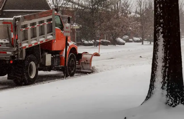 Snow clearing and snow plowing on city street